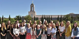 young women in front of temple