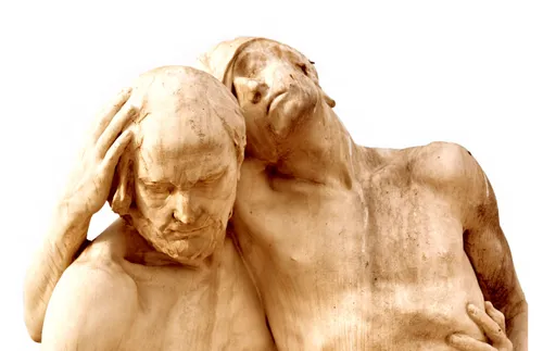 sculpture of good Samaritan helping injured man
