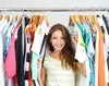 woman touching clothes on hanger