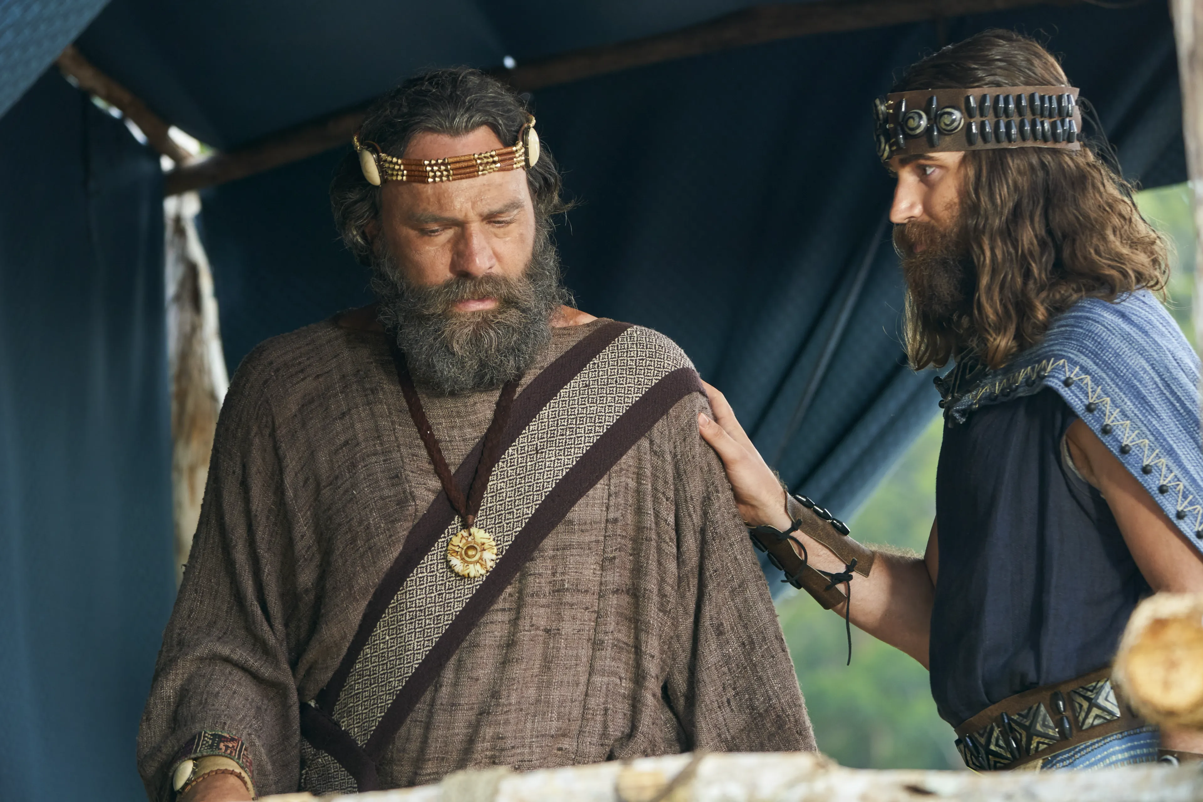 King Benjamin and Mosiah stand together on a tower talking. They are preparing to speak to the Nephites in the Land of Zarahemla.