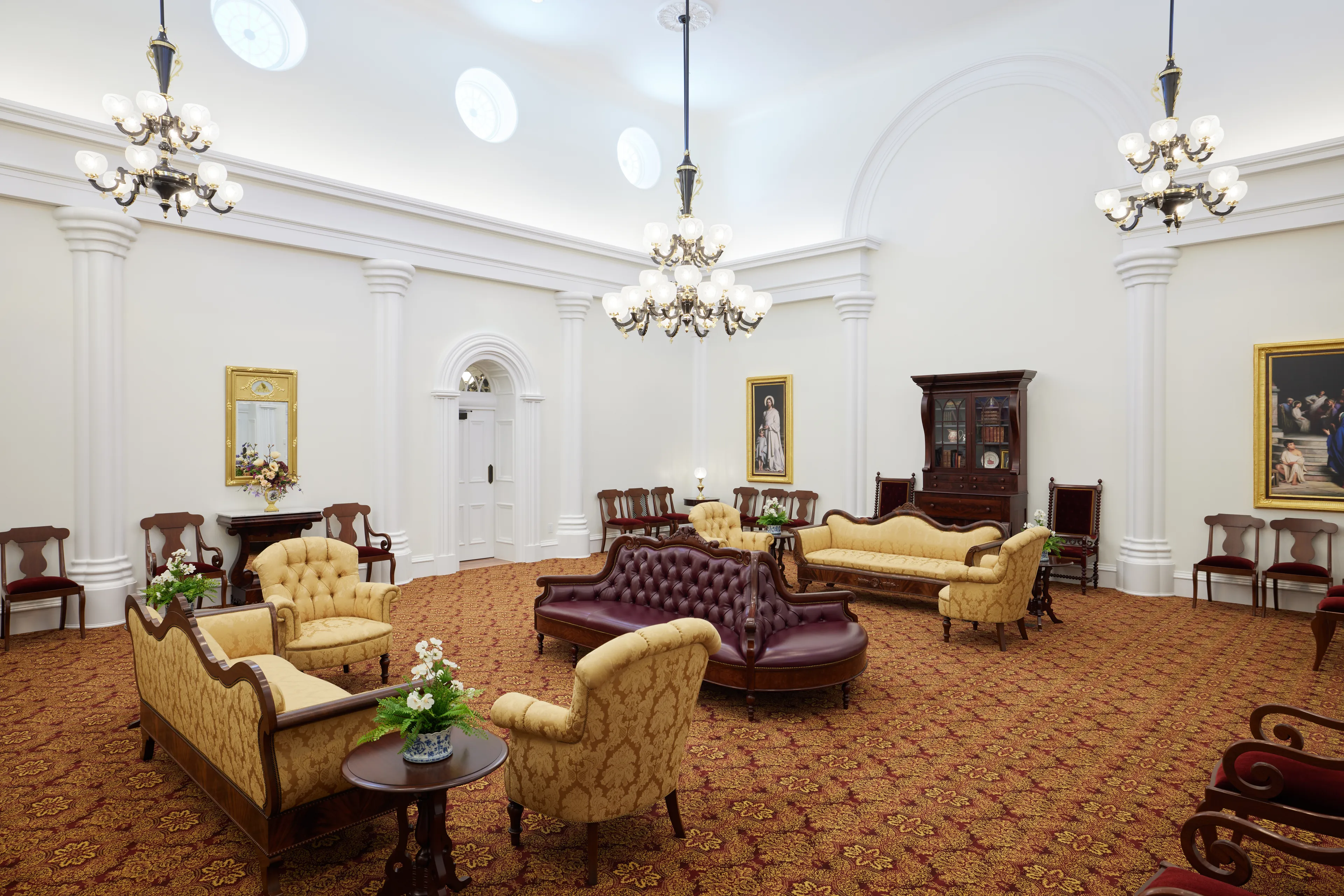 Interior image of the St. George Utah Temple. The image features what appears to be a waiting room. There are chairs and a couch throughout the space.  © undefined ipCode 1.