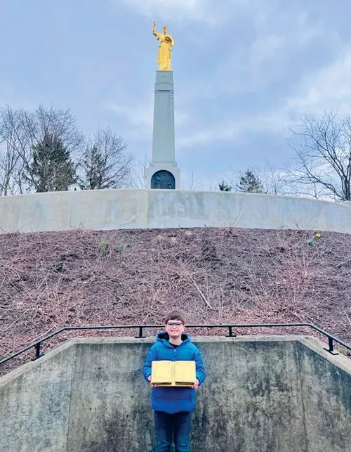 Photo of a boy named Parker McKee visiting Palmyra, New York. 