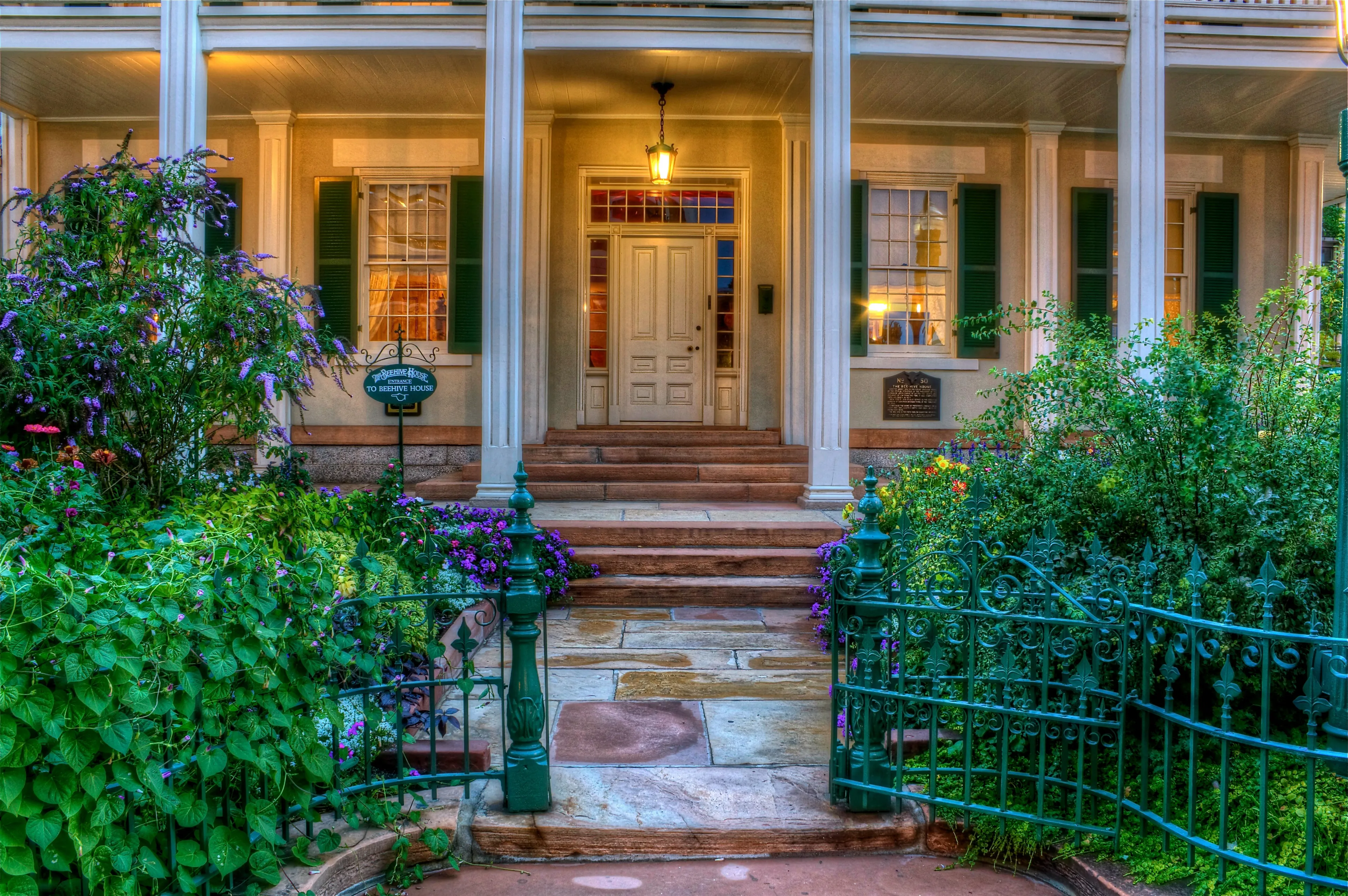 Gates and a walkway leading to the Beehive House entrance in Salt Lake City.    