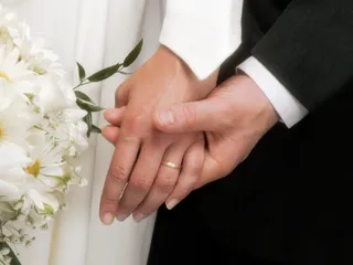 newlyweds holding hands