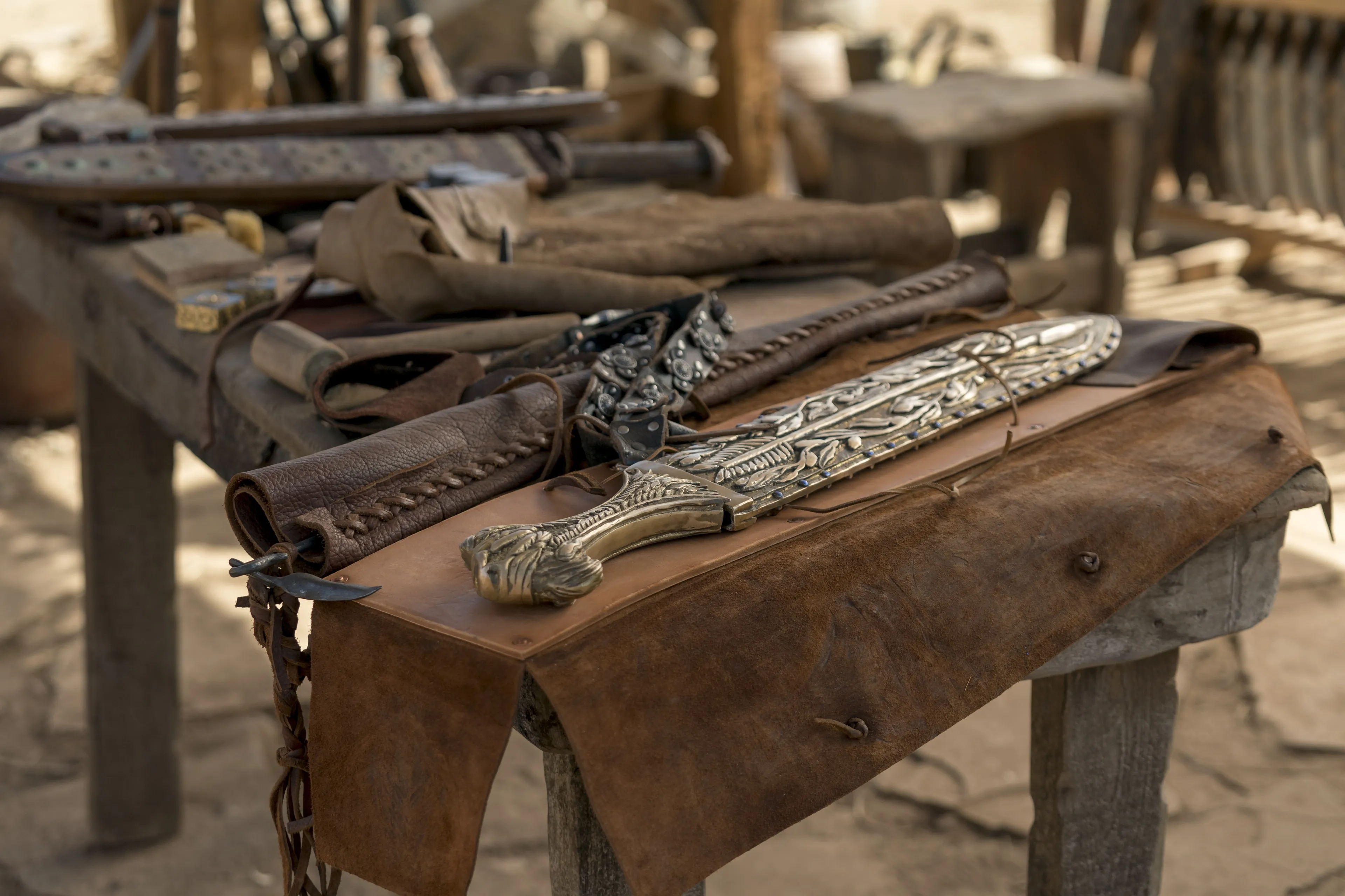 The sword of Laban and other weapons rest on a table.