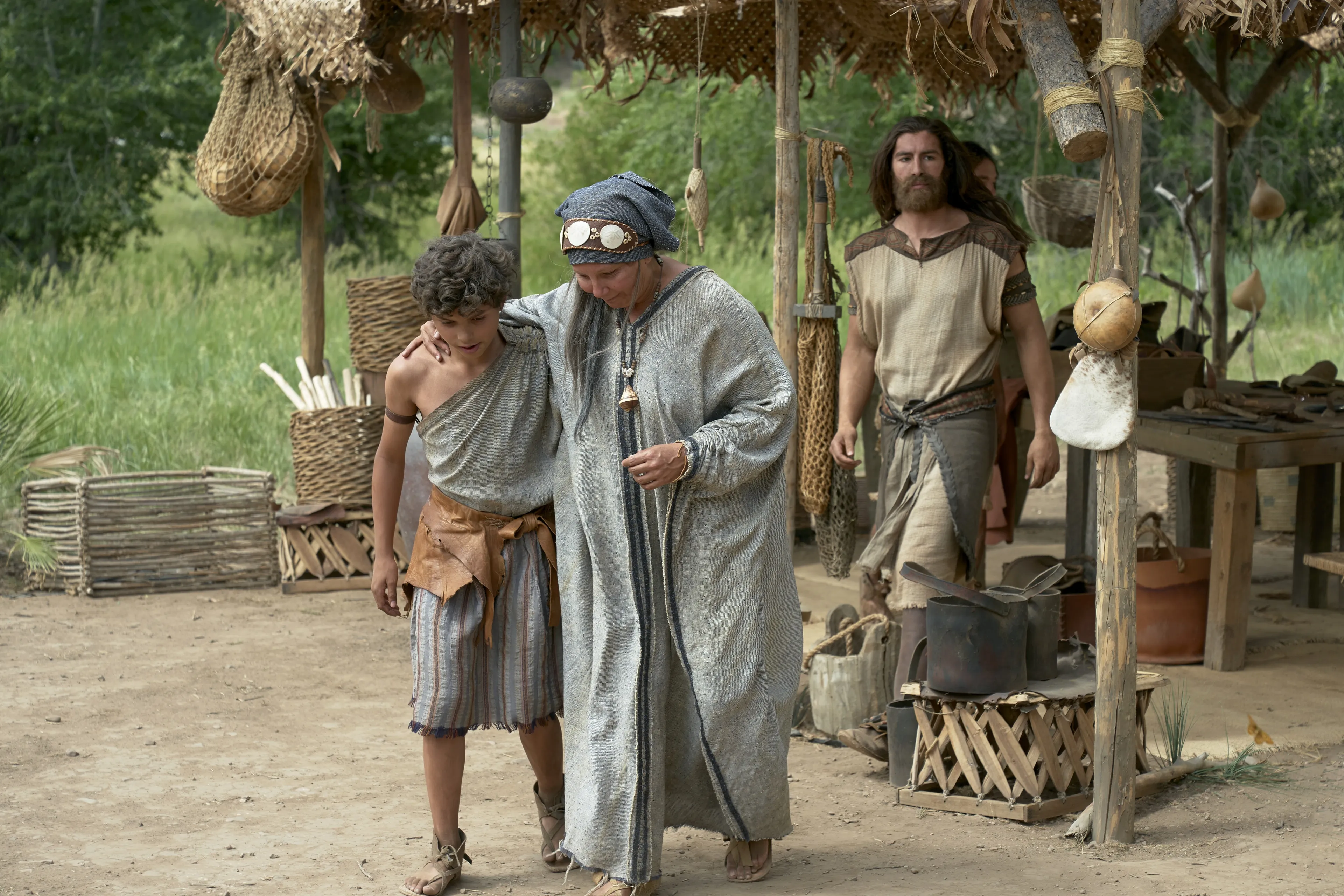 Sariah walks with her arm around Joseph.