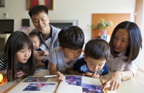 family looking at photos