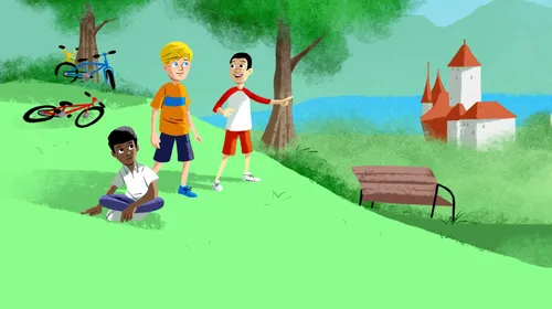 three boys sitting by bikes at a park