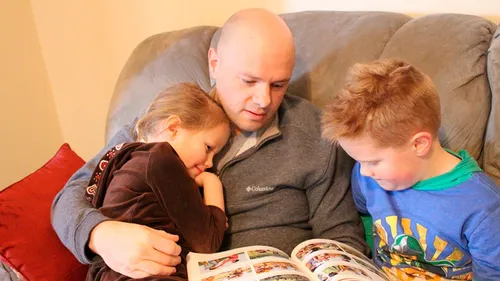 a father reading to his children