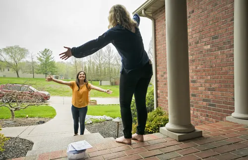 women holding out their arms
