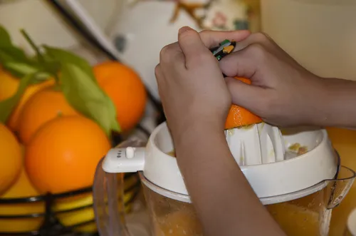 oranges being juiced