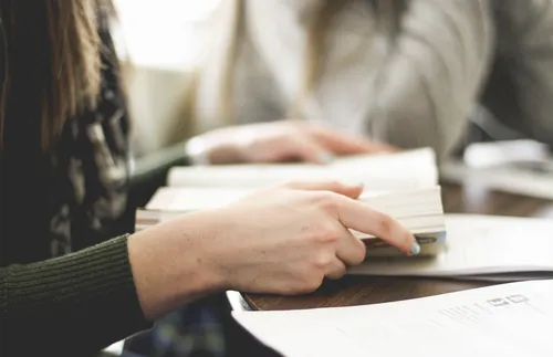 Woman holding scriptures open