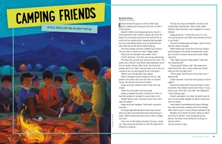 boys sitting around campfire at night