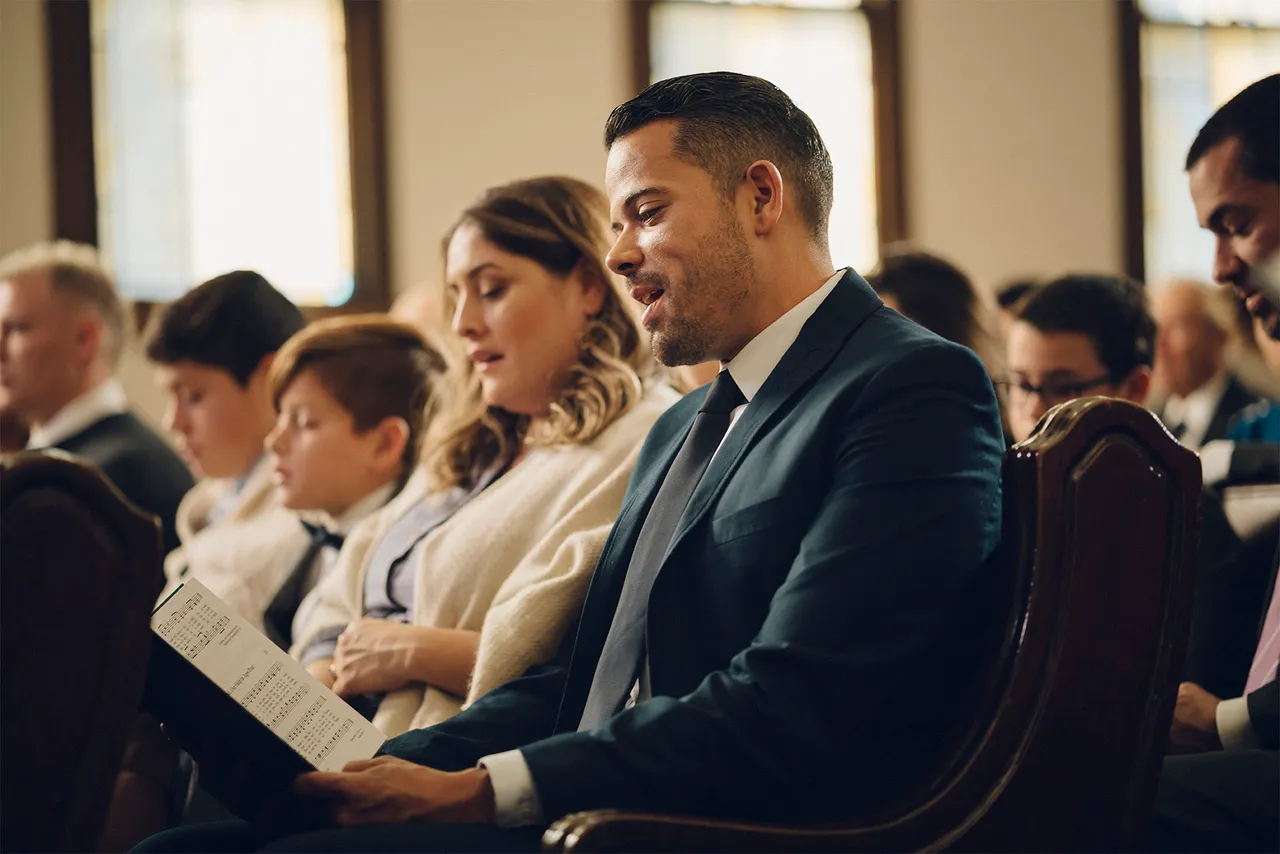 A family in a congregation learn teachings from the Bible