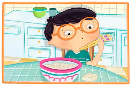 boy looks at his chopsticks