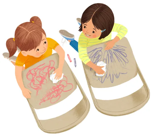 two girls cleaning crayon marks off chair