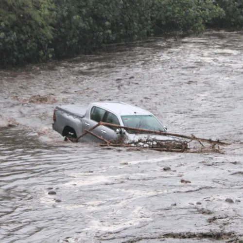 truck stuck in flooded river