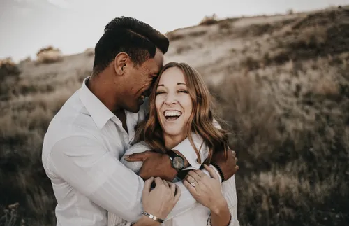 young couple embracing each other outside