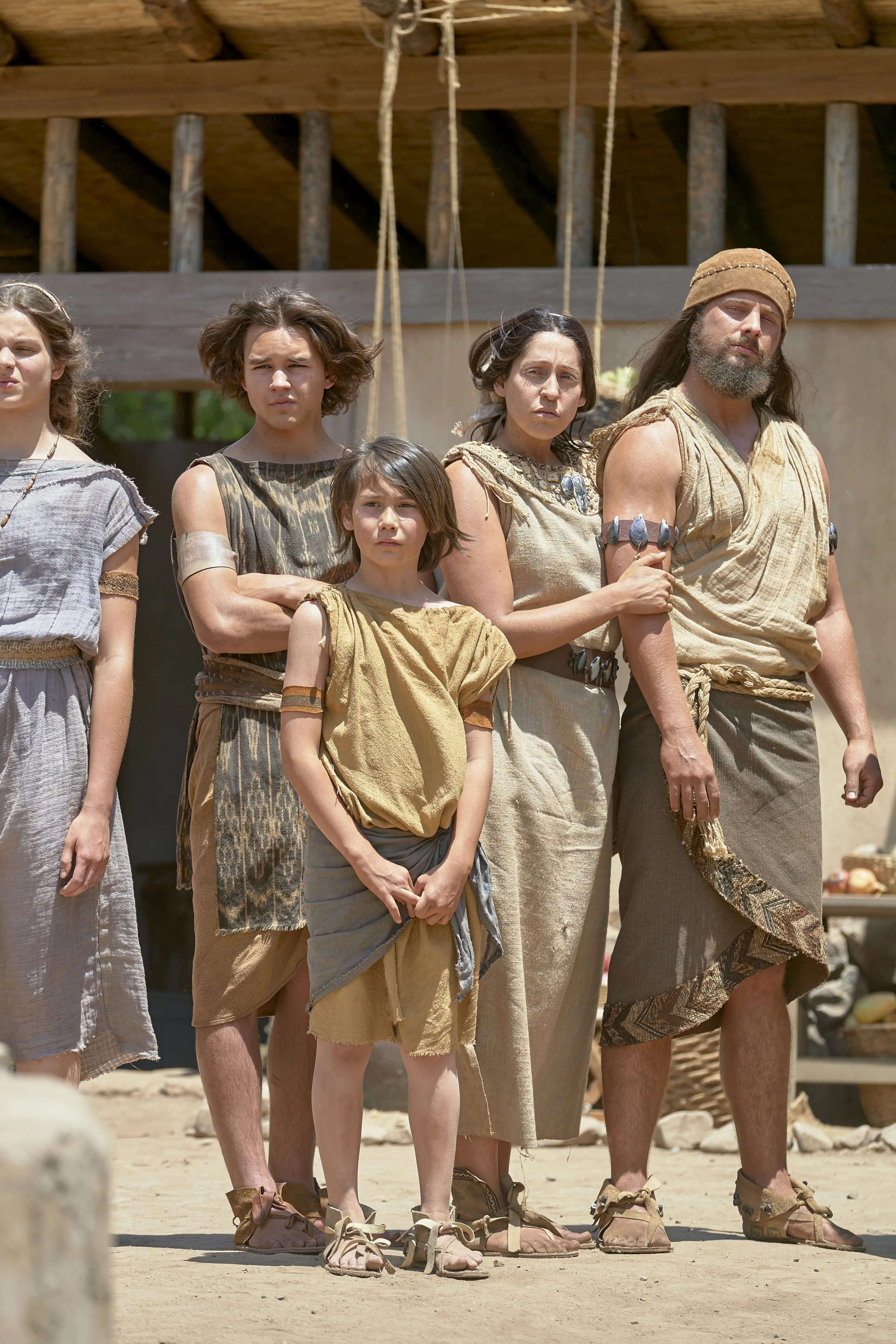 Lehi's family listens as he teaches them.