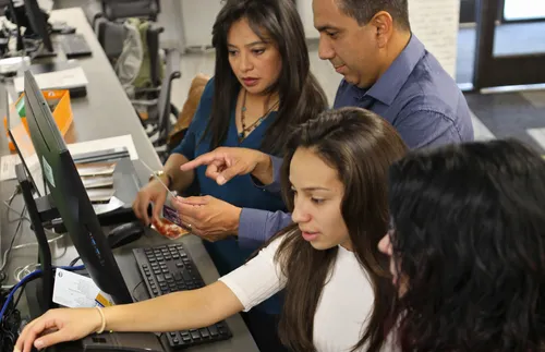 people using scanners at family history center