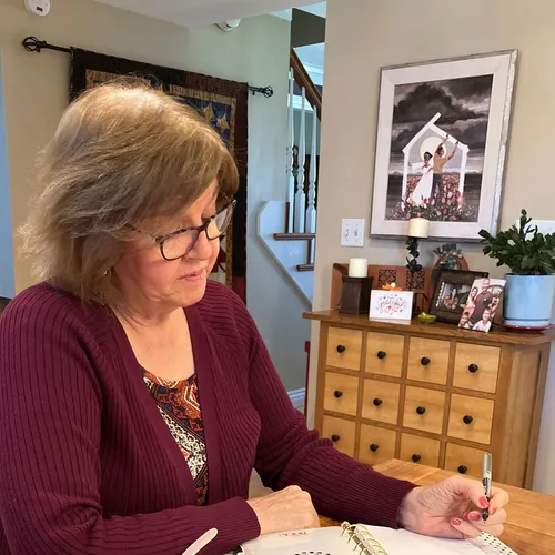 woman looking at a journal