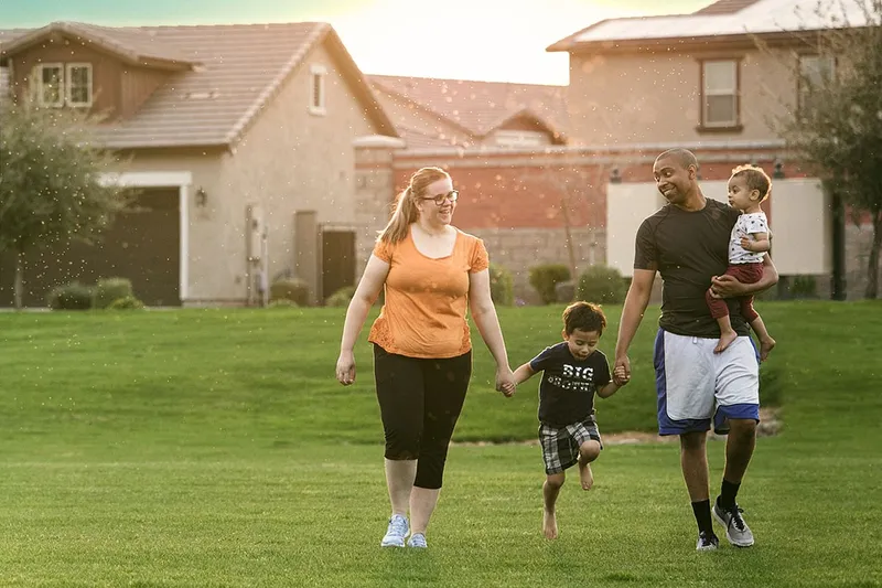 The Woods family stand together in a field and explain how the Book of Mormon has blessed their family