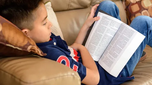 child reading the scriptures
