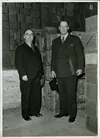 Ezra Taft Benson in Geneva, Switzerland. Caption: "Checking welfare supplies with Pres. Max Zimmer in Geneva Warehouse"  Collection Summary: Black-and-white views taken during Benson's February-December 1946 mission to postwar Europe to meet with Latter-day Saints, direct distribution of welfare supplies, and arrange for resumption of missionary work.