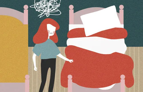 young woman making bed