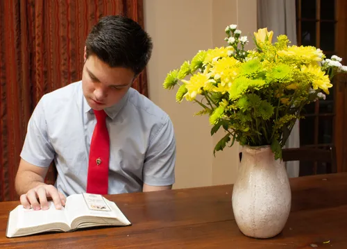 young man reading scriptures