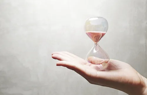 hand with hourglass