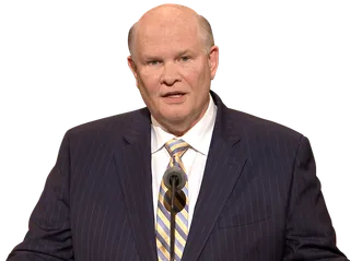 Elder Renlund speaking at pulpit