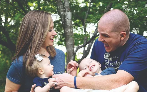 a family smiling and laughing together