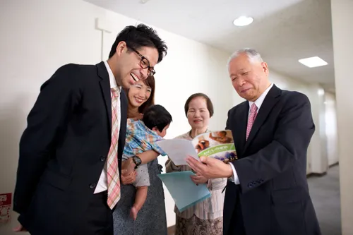 family looking at family history materials