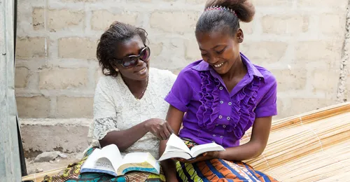 mother and daughter studying scriptures