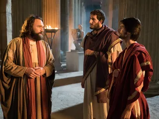 Peter preaching to a group of people