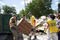 A community comes together to clean up after a natural disaster