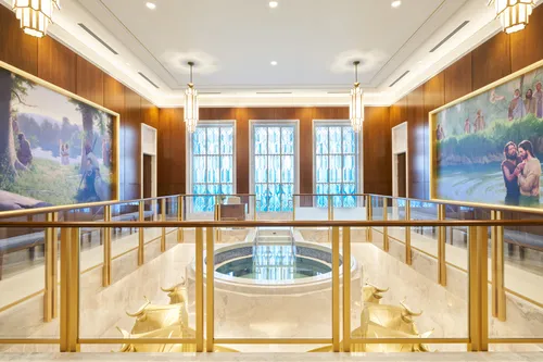 Interior image of the Brasilia Brazil Temple baptistry. Image features the font and art around the room. 