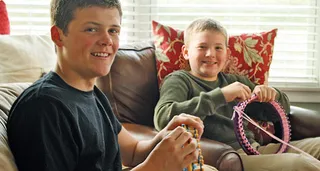 two young men knitting