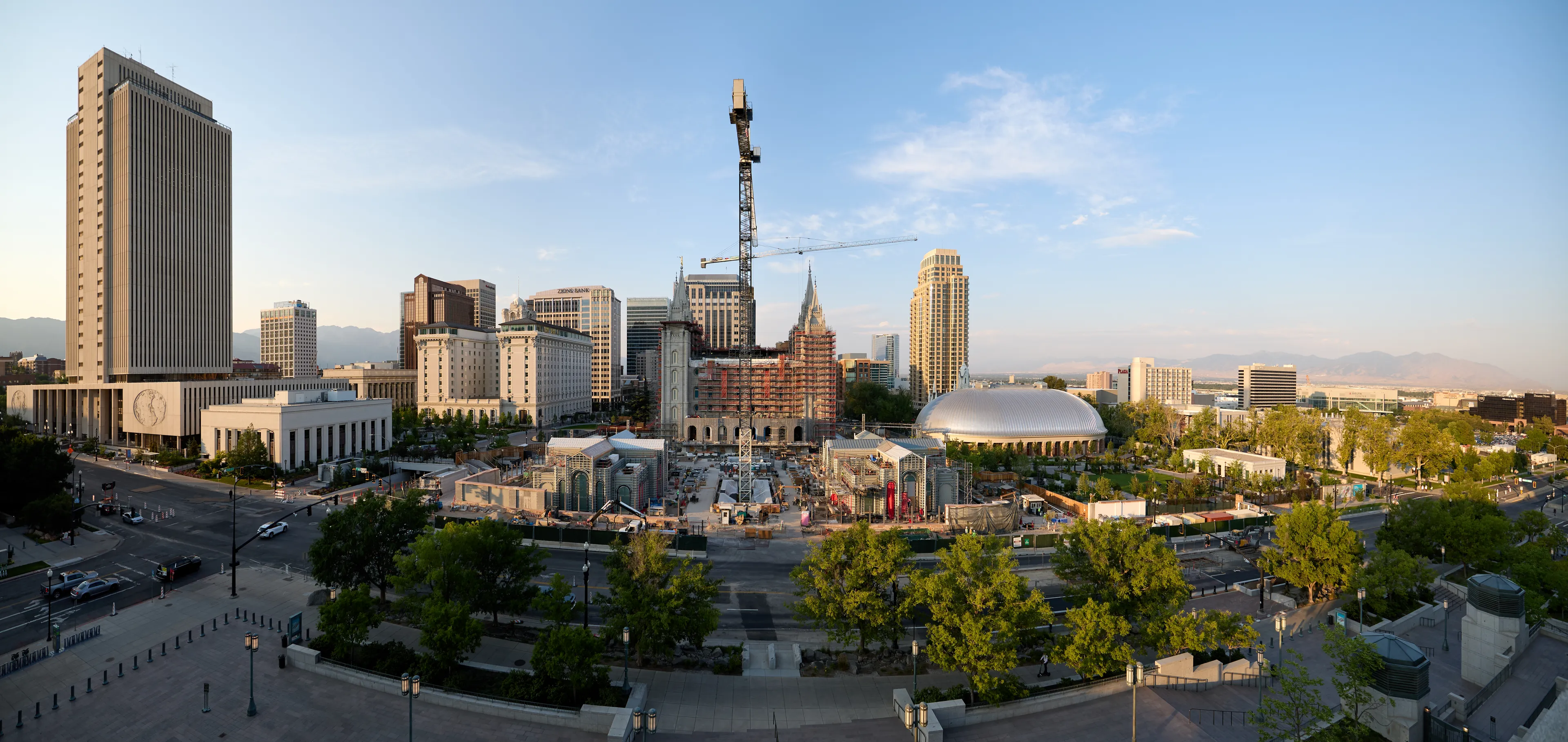 A view of Temple Square during renovations in July 2025. The image features an overview of the Salt Lake Temple and other buildings from the roof of the Conference Center.