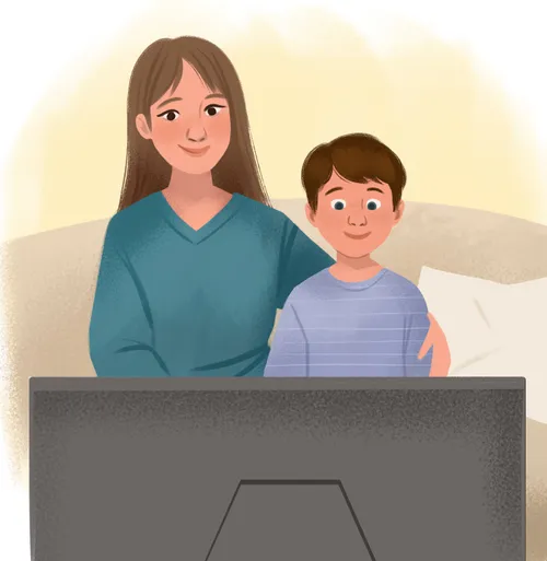 Boy and mom sitting on the couch togther watching the TV