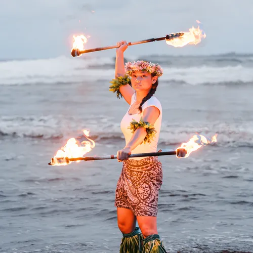 young woman with two torches
