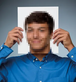 young man holding pixellated photo