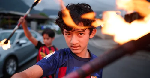 young man with a torch