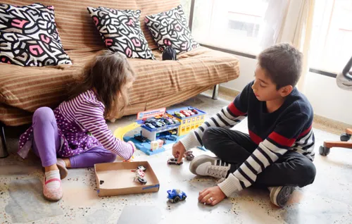 Ruben playing with his little sister