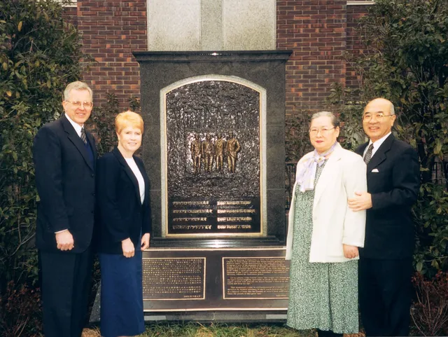 Elder D. Todd Christofferson and his wife, Kathy, with Elder Yoshihiko Kikuchi and his wife, Toshiko, at a memorial marking the dedication of Japan for the preaching of the gospel, circa 2003.