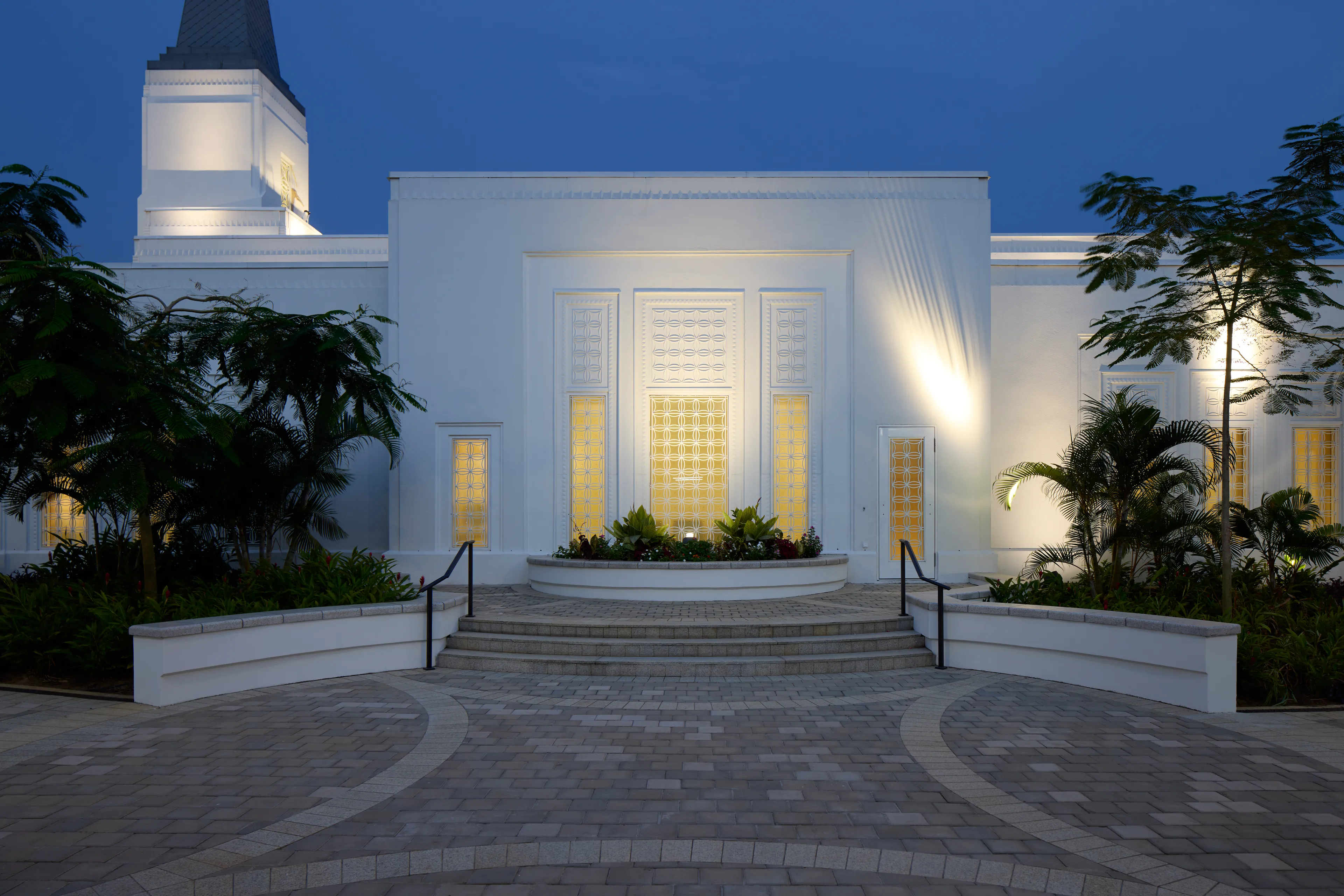 Exterior image of the Abidjan Ivory Coast Temple featuring the architecture of pathways leading to the temple doors.