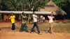 children volunteers carry a water pipe