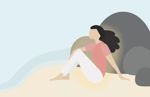 woman sitting on a beach