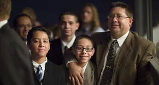 father and sons at conference